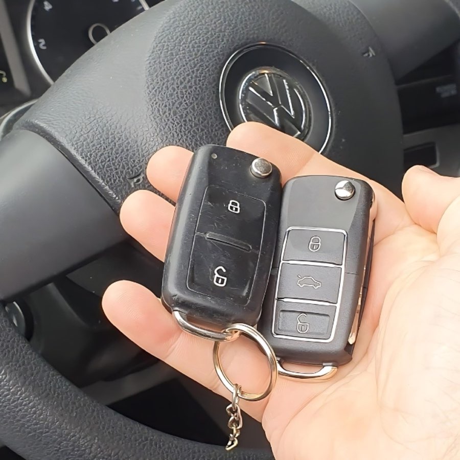 Auto locksmith working at a car door
